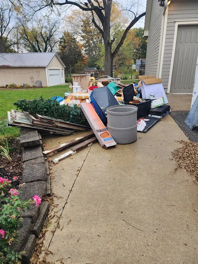 Dumpster being loaded with debris for 3 Yard Dumpster Rental in Winter Haven